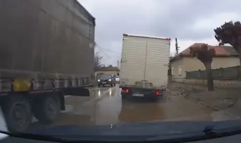 A major road is closed for repairs, and tracks run through narrow streets with potholes  - 1