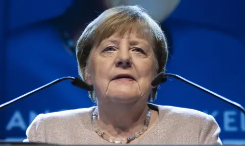 Merkel defends migration policy she led as chancellor  - 1