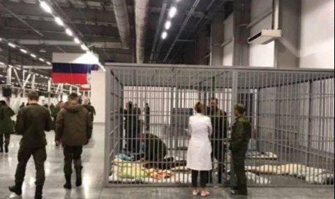 Държат в клетка пияни мобилизирани руски войници - 1