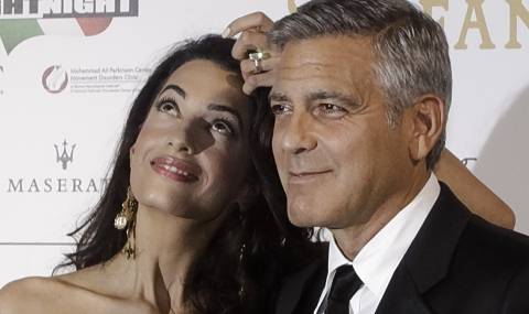 Клуни дава 1,3 милиона за раждането на децата му - 1