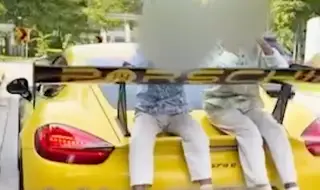 Глобиха и взеха книжката на баща возещ децата си върху задния капак на Porsche (ВИДЕО)