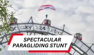 Екстремeн спортист скочи с параглайдер от 65-метрово виенско колело ВИДЕО