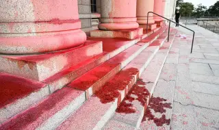 Eco-activists covered the Finnish parliament building with red paint in protest against peat mining 