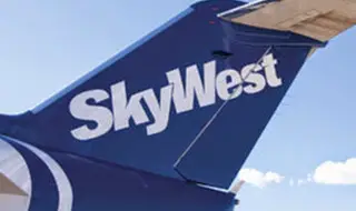 Passenger attacks flight attendant and tries to open emergency door on plane during flight 